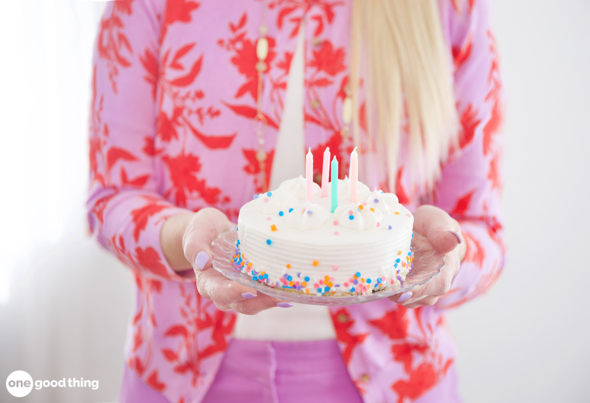 birthday wishes for daughters A mom holding a birthday cake.