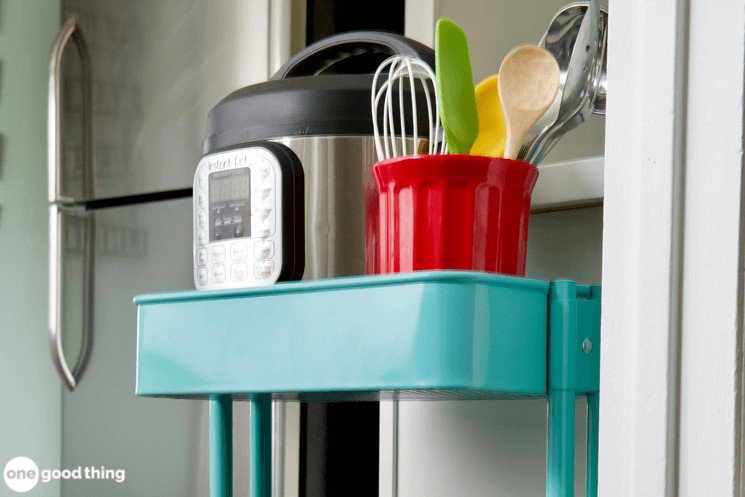 Ikea Cart A pot, pans and utensils are on an IKEA cart in a kitchen.